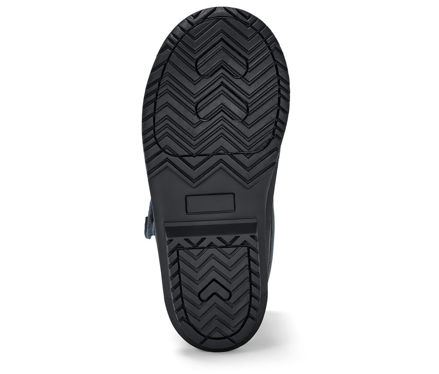 Semelle d'une botte noire avec un motif géométrique de cœur.