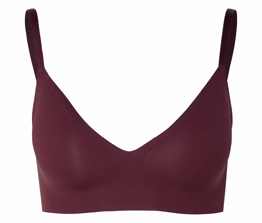 Soutien-gorge bordeaux à col en V et fines bretelles sur fond neutre.