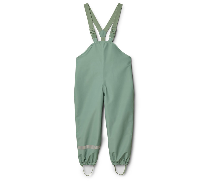Pantalon de pluie vert clair à bretelles avec bandes réfléchissantes sur les jambes.
