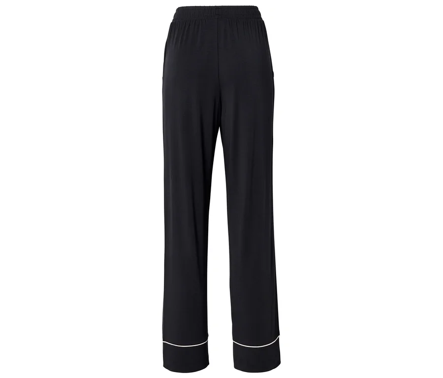 Pantalon noir ample avec un liseré blanc au bas des jambes.