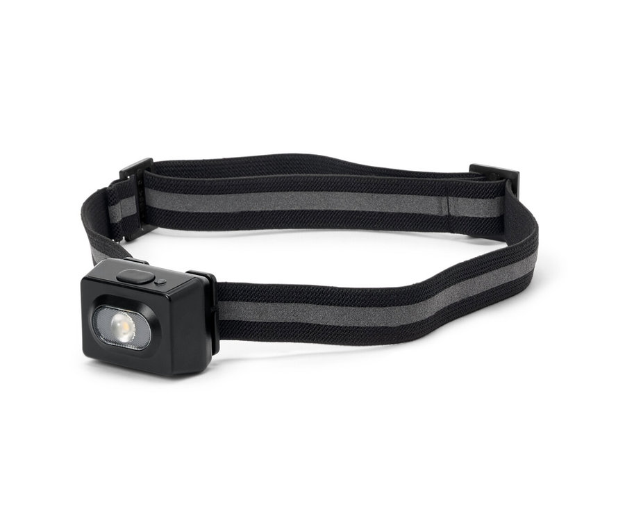 Lampe frontale avec boîtier noir et sangle à rayures grises.