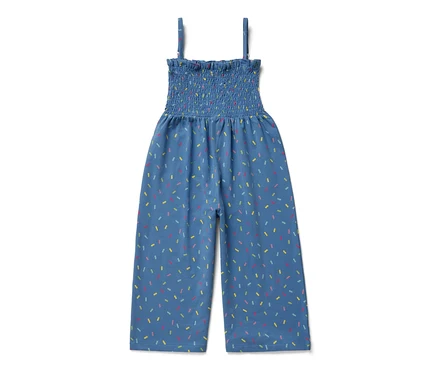 Combinaison bleue longueur 7/8 avec motif coloré.