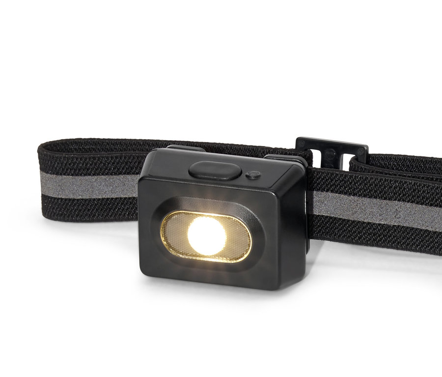 Gros plan d'une lampe frontale noire.