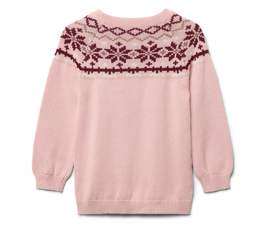 Pull rose avec motif de Noël sur le haut.