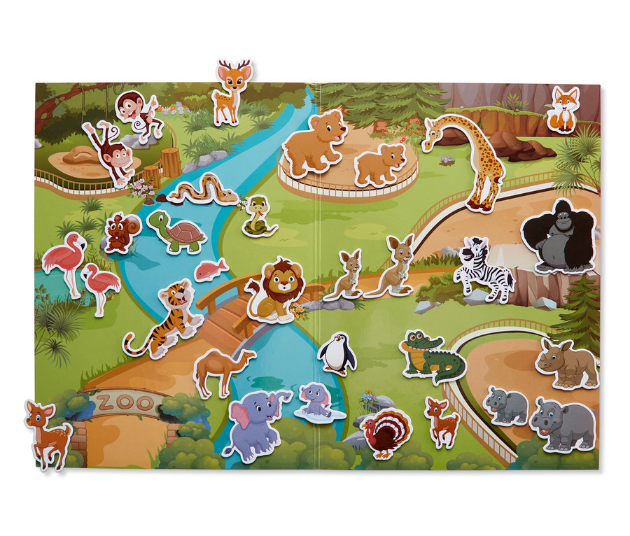 Livre de jeu magnétique ouvert avec une illustration de zoo et des aimants d'animaux.