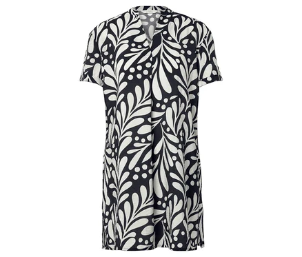 Une robe noire avec des feuilles blanches et des pois.