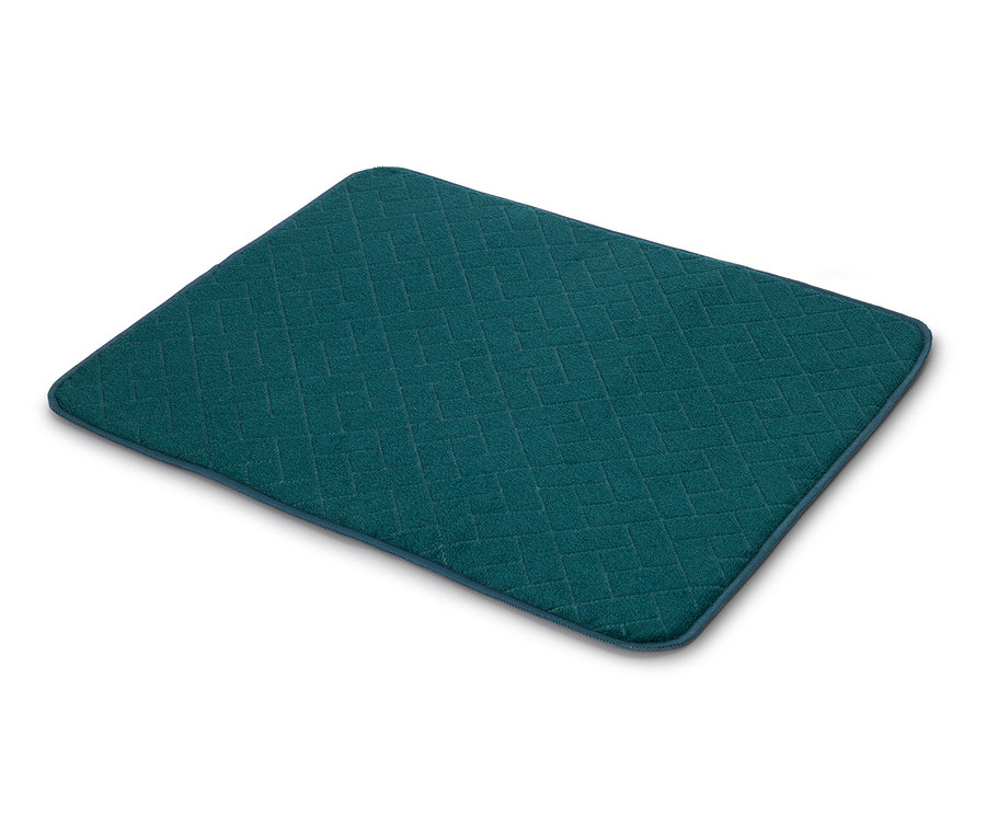 Un égouttoir rectangulaire bleu pétrole avec un motif matelassé en losanges sur fond blanc.