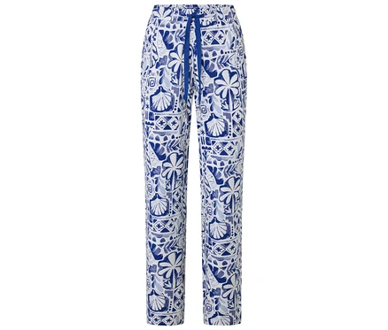 Pantalon de pyjama blanc à motif bleu de coquillages, feuilles et formes abstraites, avec cordon de serrage bleu.