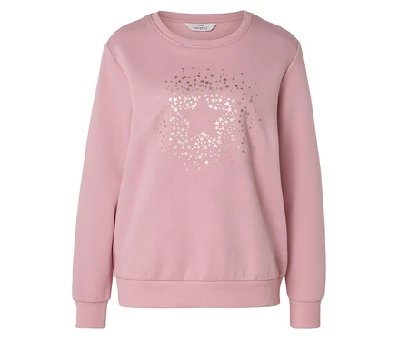 Un sweat-shirt rose à col rond avec des manches longues et des poignets côtelés. Le devant présente un grand motif d'étoile composé de petites étoiles dorées métalliques, avec des étoiles supplémentaires dispersées autour.