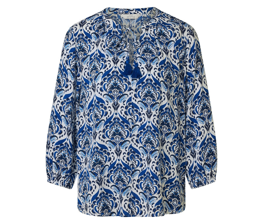Blouse à motif bleu et blanc avec détail de pompon.