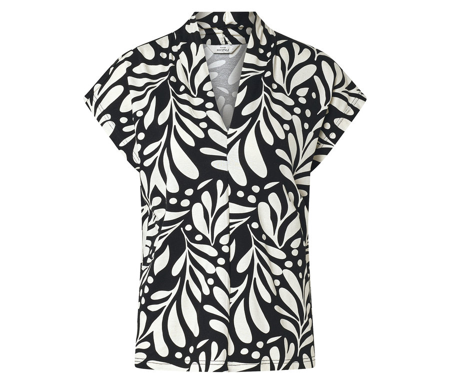 Chemise à manches courtes noire et blanche avec motif de feuilles et de points.