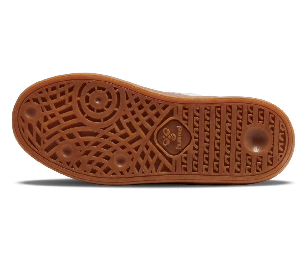 Gros plan sur la semelle d'une basket bleue hummel® Handball Perfekt CL JR avec une semelle marron.