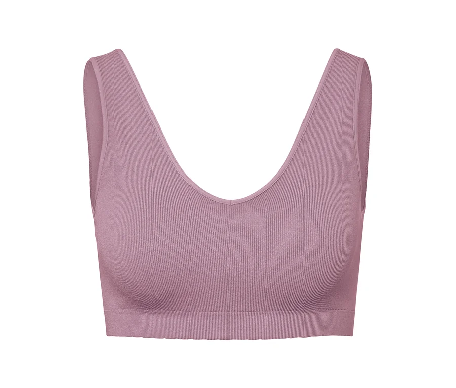 Soutien-gorge de sport rose avec motif côtelé.