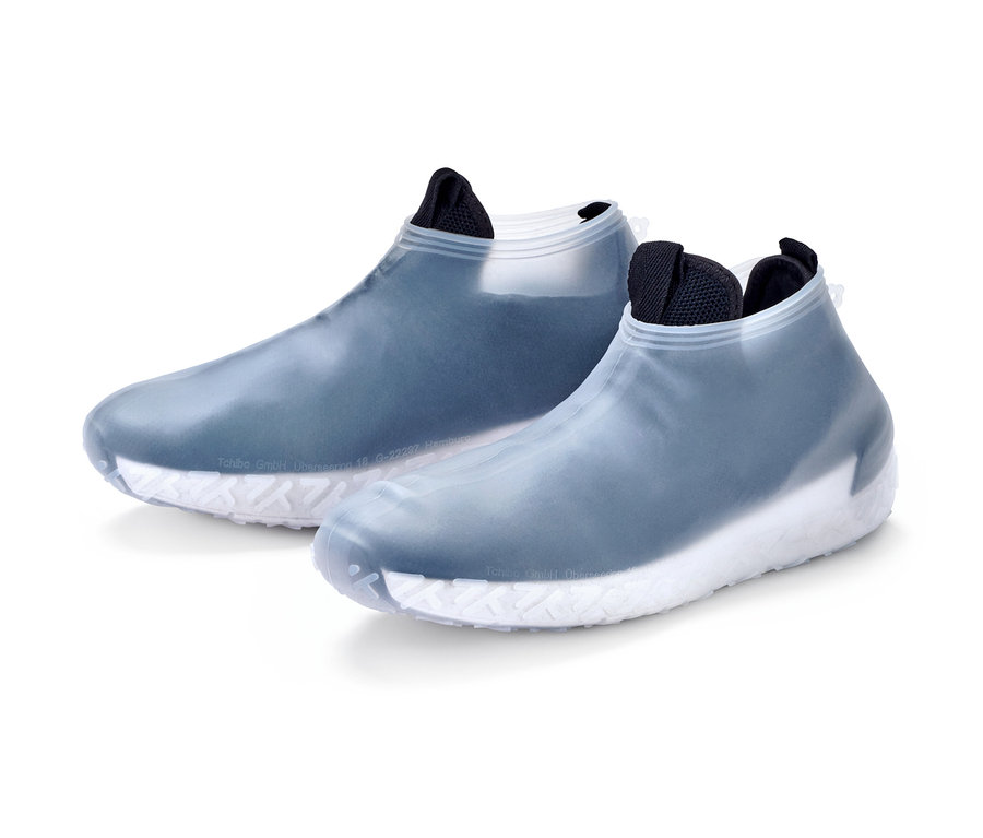 Deux couvre-chaussures de pluie avec semelle blanche.