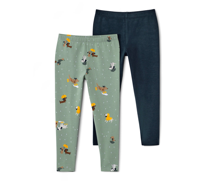 Deux leggings pour enfant : un vert clair avec un imprimé de chiens, un bleu foncé.