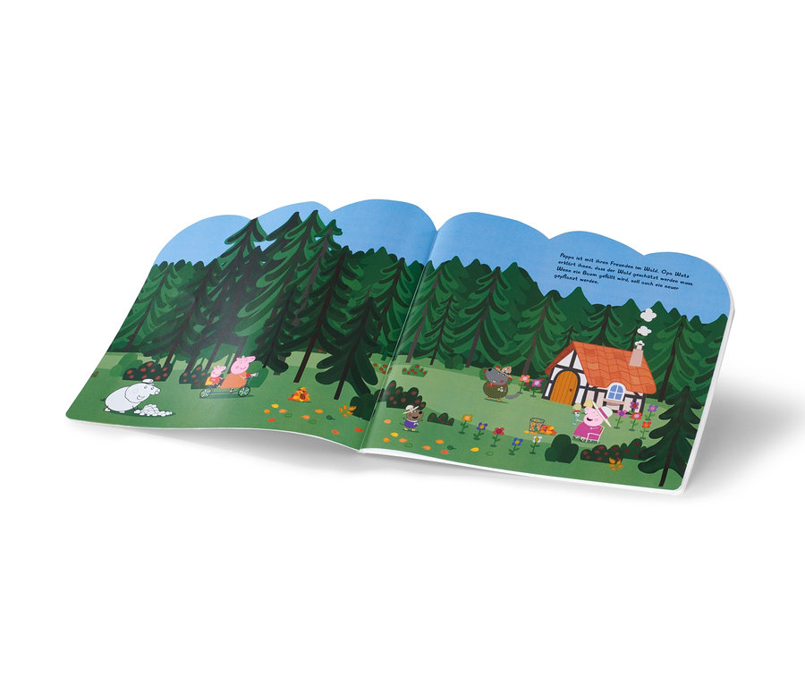 Livre ouvert avec une illustration de Peppa Pig et ses amis dans la forêt.
