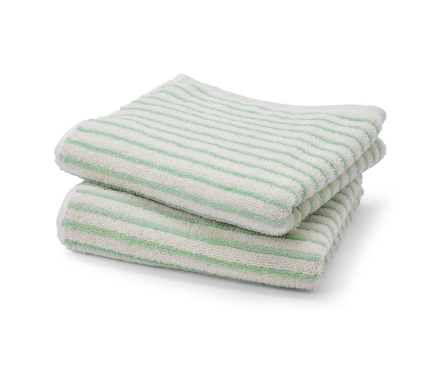 Deux linges rayés verts l'un sur l'autre.