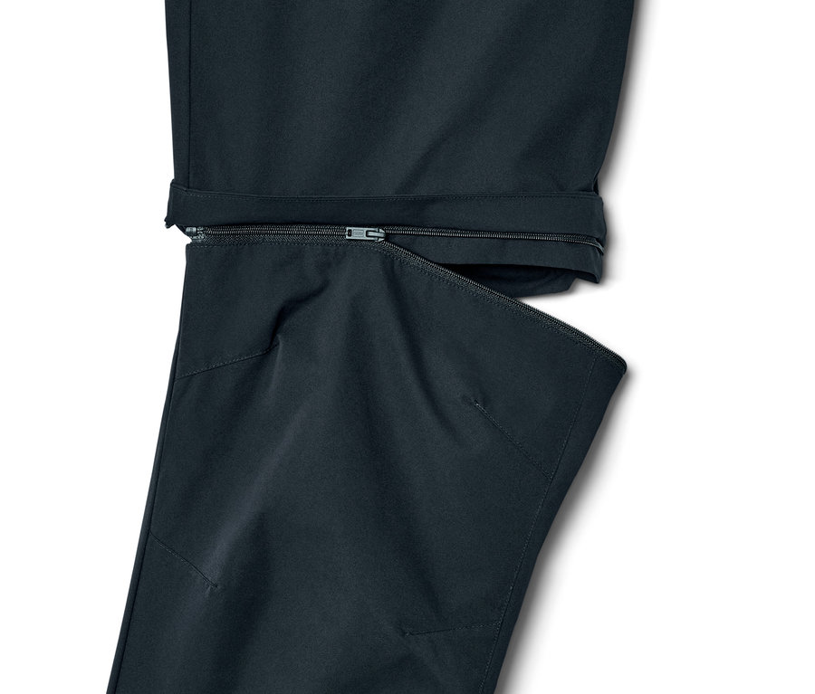 Détail d'un pantalon fonctionnel 2 en 1 bleu marine avec fermeture éclair.
