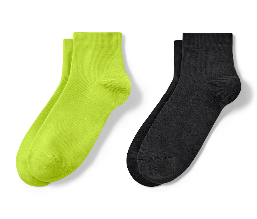 Deux paires de chaussettes de sport courtes : vert néon et noir.