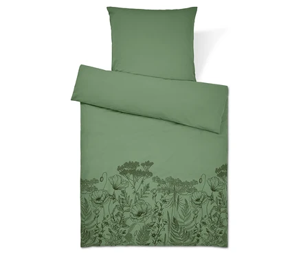Literie verte avec motif floral. Oreiller en haut.