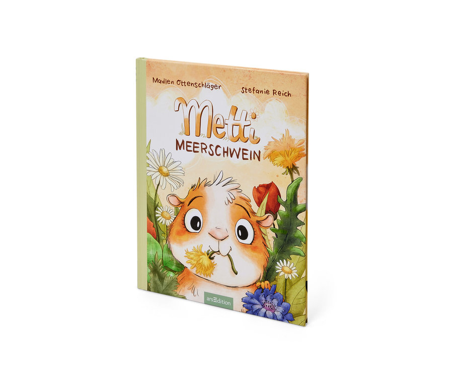 La couverture du livre « Metti, le cochon d’Inde » montre une illustration d’un cochon d’Inde tenant un pissenlit dans sa gueule.