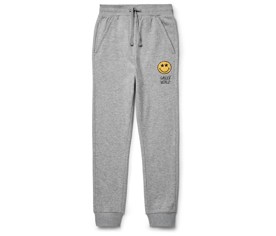Pantalon de jogging gris avec un smiley jaune.
