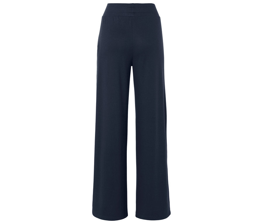 Pantalon large bleu foncé vu de dos.