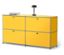 Meuble de rangement jaune avec quatre portes, sur lequel sont posés deux livres et une lampe.