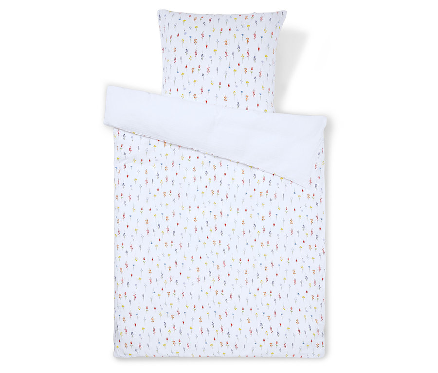 Ensemble de literie à motif floral, comprenant une taie d'oreiller et une housse de couette.