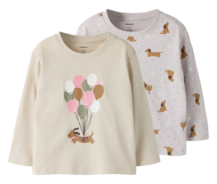 Deux t-shirts à manches longues NAME IT, un beige avec un teckel accroché à des ballons, l'autre lilas avec un motif de teckels.