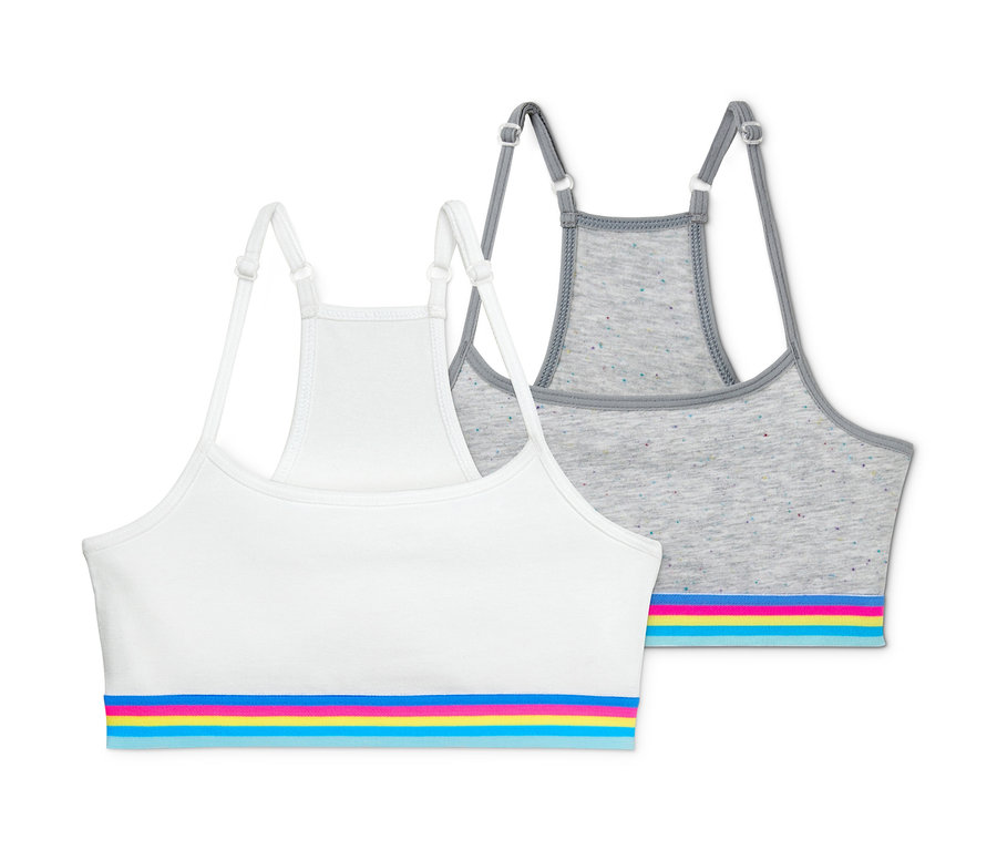 Deux brassières fille, une blanche et une grise, chacune avec des rayures colorées.
