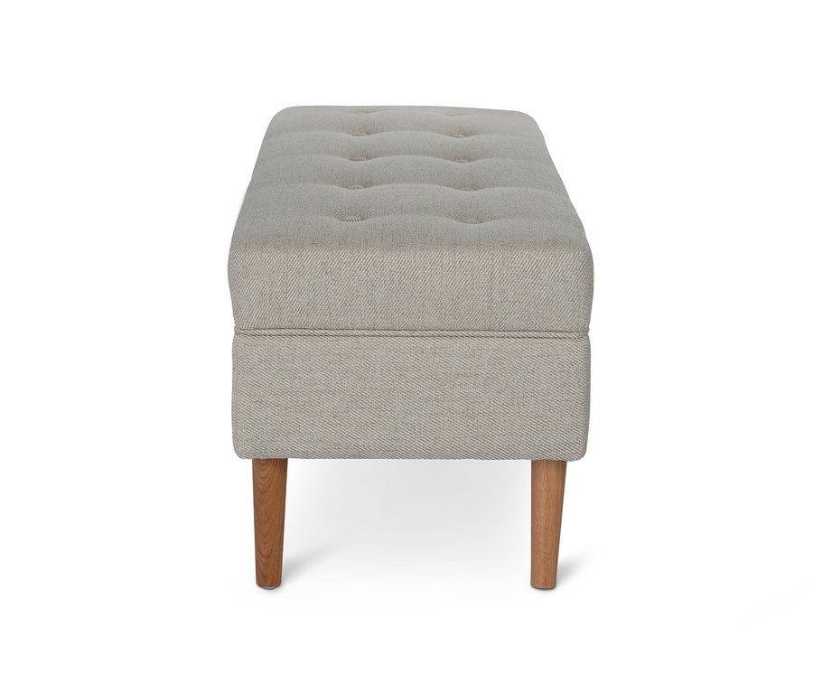 Banc rembourré avec espace de rangement et boutons.