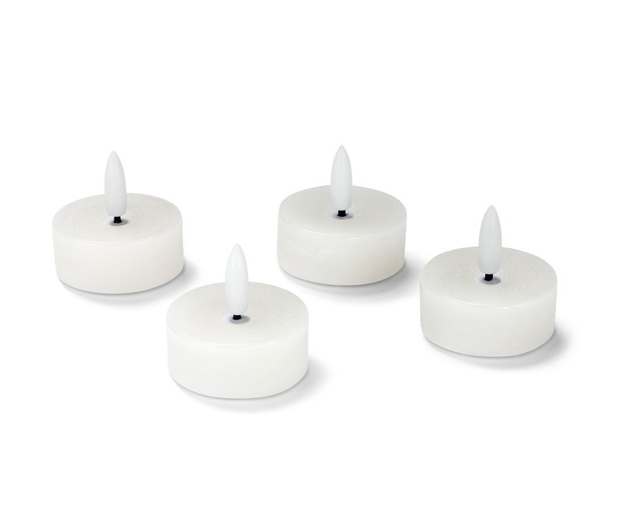 Quatre bougies chauffe-plat blanches en cire avec LED.