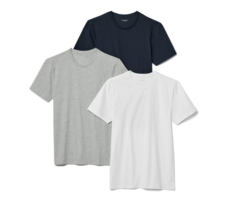 Trois t-shirts à encolure ronde bleu marine, gris et blanc.