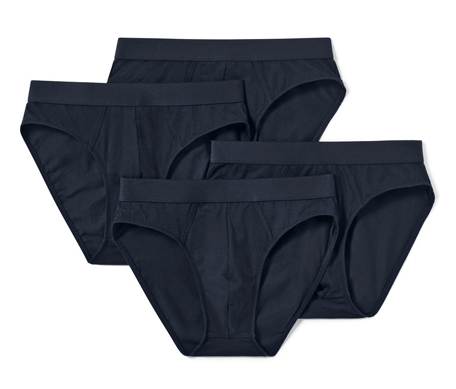Quatre slips bleu foncé disposés sur un fond blanc.