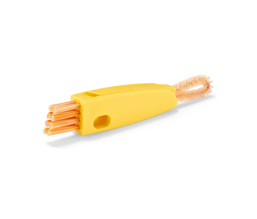 Brosse de nettoyage 3 en 1 jaune avec des poils orange.
