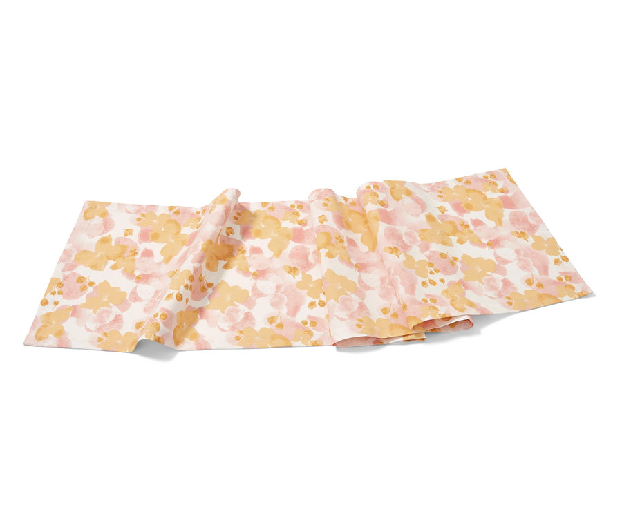 Chemin de table à motif floral rose et jaune.