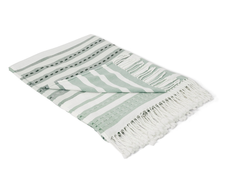 Plaid plié à rayures blanches et vertes.