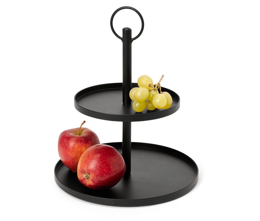 Présentoir à deux étages noir avec des pommes et des raisins.