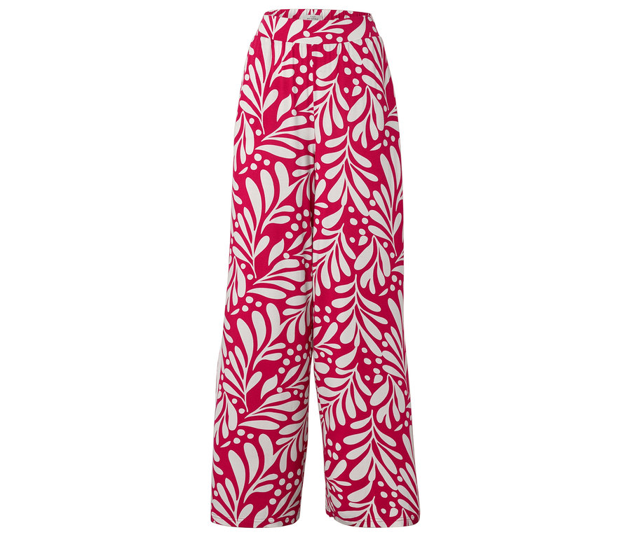 Pantalon rouge avec motif de feuilles blanches.