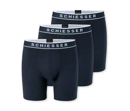 Trois boxers bleu foncé avec des ceintures blanches, chacun affichant le logo « SCHIESSER », sont empilés et légèrement superposés sur un fond blanc.