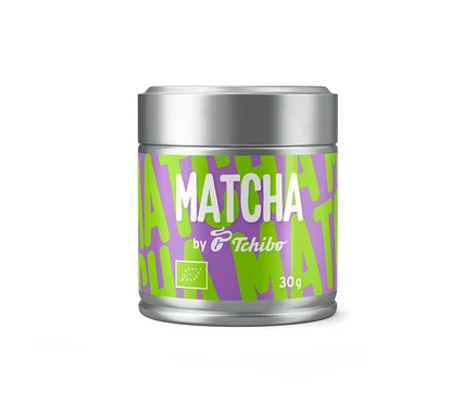 Boîte argentée de thé BIO TC Matcha by Tchibo 30g avec une étiquette violette, un motif vert et du texte blanc.