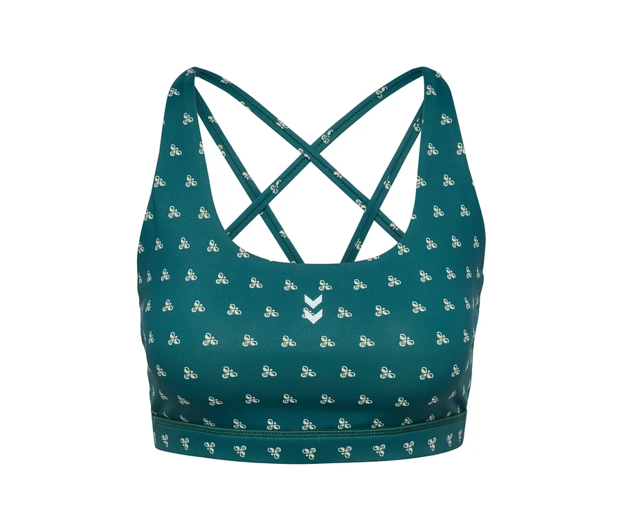 Gros plan d'un soutien-gorge de sport HUMMEL vert avec motif blanc et bretelles croisées.