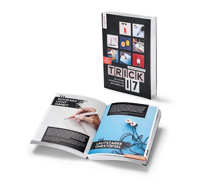 Un livre ouvert « Trick 17 » avec des descriptions d'astuces quotidiennes.