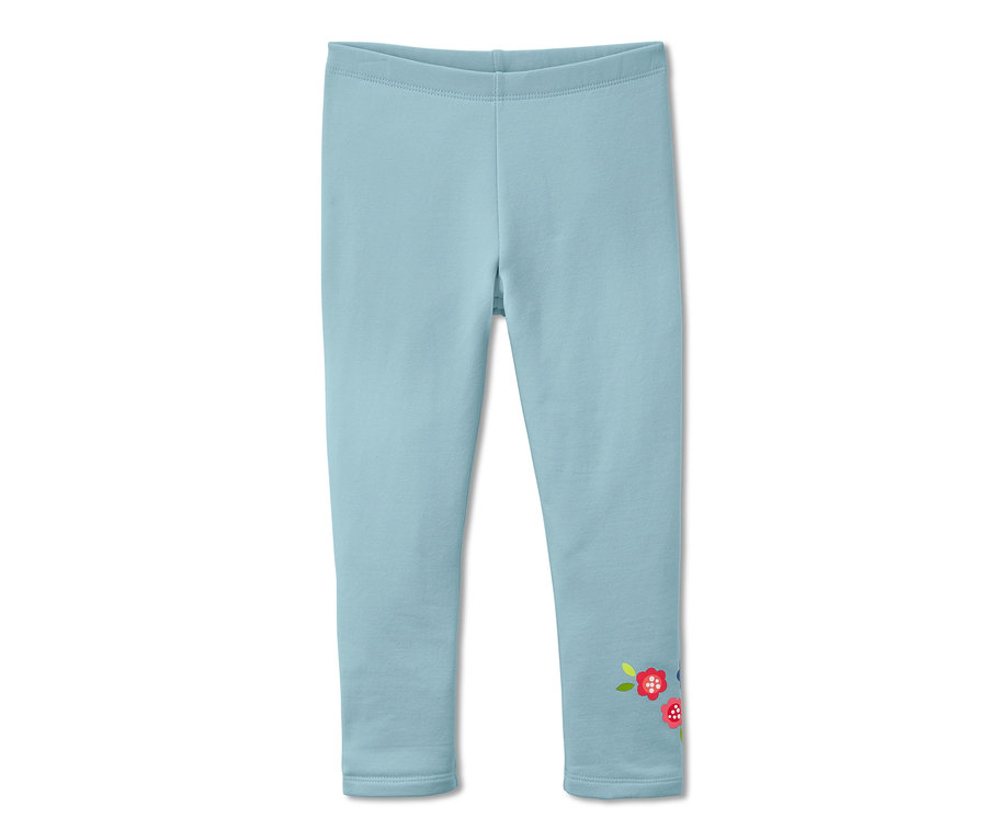 Pantalon de survêtement bleu clair avec un motif floral sur la jambe.