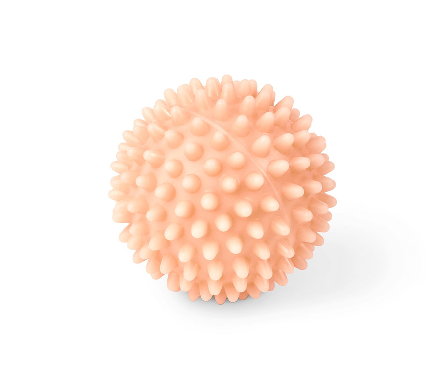 Balle de massage anti-cellulite couleur pêche.