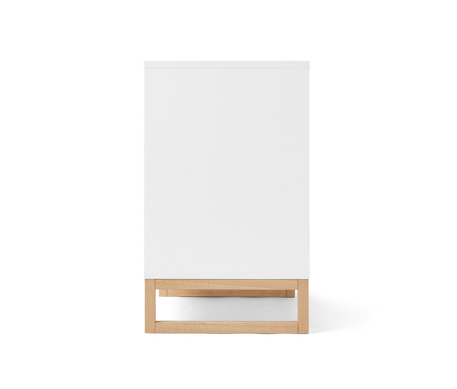 Meuble sous-vasque blanc avec porte et espace latéral.