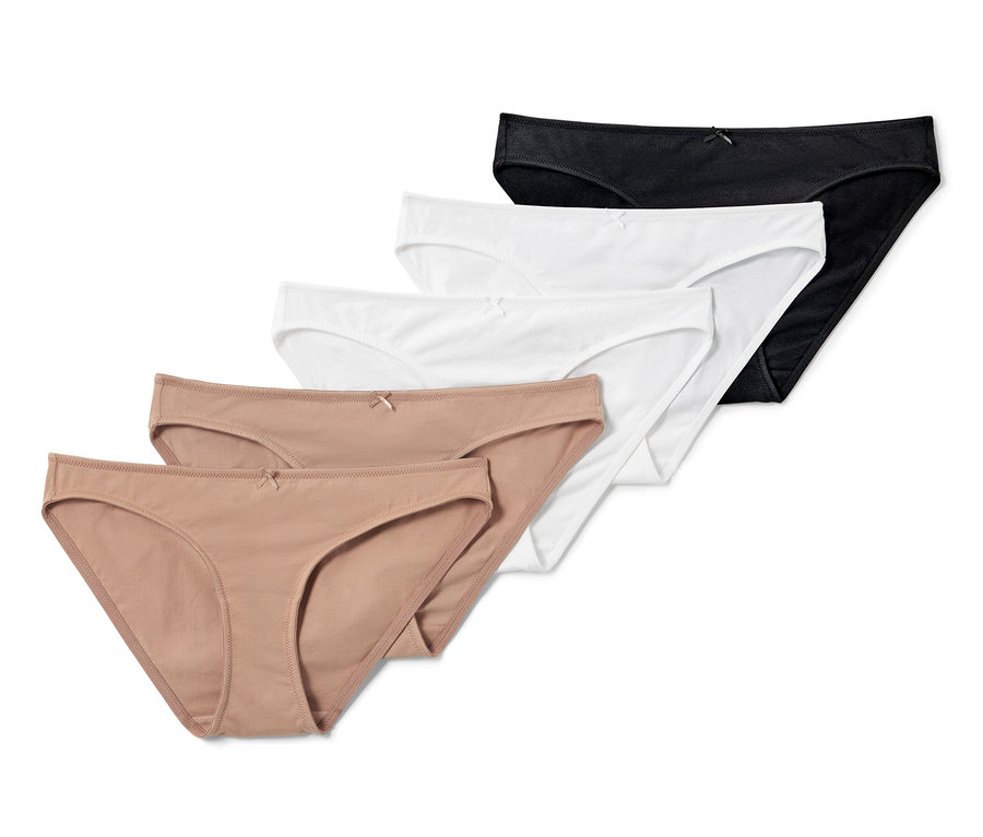 Cinq slips unicolores en noir, blanc et beige.