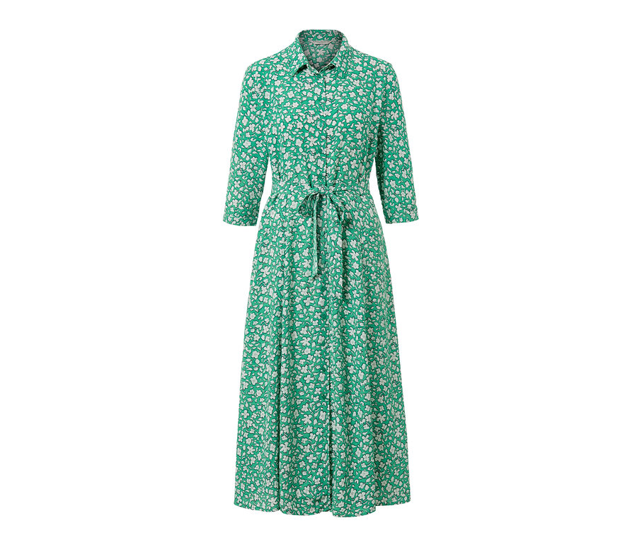 Robe chemise verte avec un imprimé floral blanc et une ceinture.