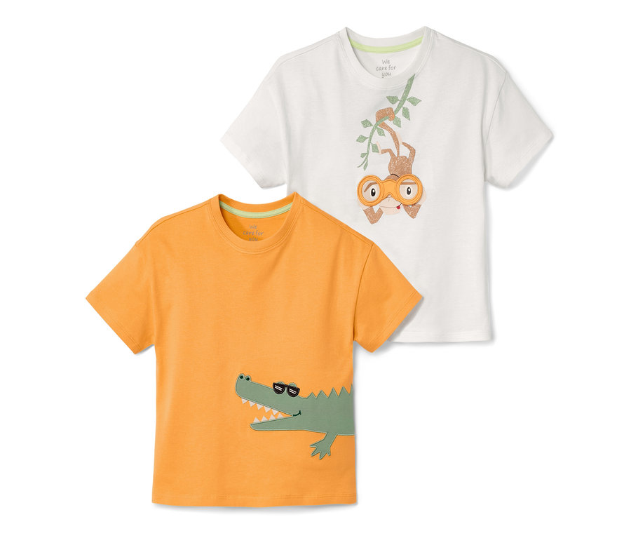 Deux t-shirts pour enfant : un orange avec un crocodile, un blanc avec un singe.